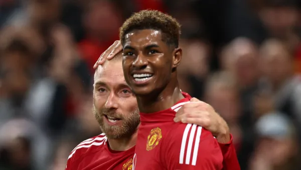 Manchester United's Danish midfielder #14 Christian Eriksen (L) celebrates with Manchester United's English striker #10 Marcus Rashford after scoring his teams first goal during the UEFA Europa league stage football match between Manchester United and FC Twente at Old Trafford stadium in Manchester, north west England, on September 25, 2024. (Photo by Darren Staples / AFP)