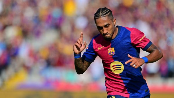 Barcelona's Brazilian forward #11 Raphinha celebrates scoring his team's first goal during the Spanish league football match between FC Barcelona and Real Valladolid FC at the Estadi Olimpic Lluis Companys in Barcelona on August 31, 2024. (Photo by MANU QUINTERO / AFP)