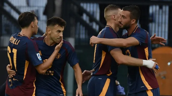 Roma's Ukrainian forward #11 Artem Dovbyk (2ndR) celebrates with teammates Roma's Italian midfielder #04 Bryan Christante, Roma's Italian forward #92 Stephan El Shaarawy and Roma's Italian midfielder #61 Niccolo Pisilli after scoring his team first goal during the Italian Serie A football match between AS Roma and Udinese at the Olympic stadium in Rome on September 22, 2024. (Photo by Filippo MONTEFORTE / AFP)