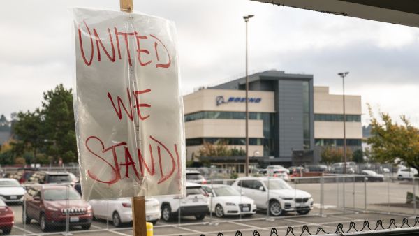 A sign is seen on a fence as Boeing workers gather on a picket line near the entrance to a Boeing facility during an ongoing strike on October 24, 2024 in Seattle, Washington.  A sign is seen on a fence as Boeing workers gather on a picket line near the entrance to a Boeing facility during an ongoing strike on October 24, 2024 in Seattle, Washington.  Boeing seeks $19B in stock sale to stabilize finances amid labor strike