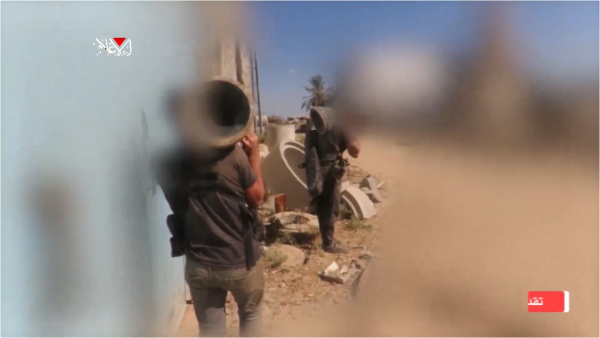 Al-Qassam Brigades Fighters holding  "Shawaz" explosives
