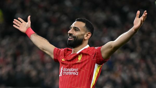 Liverpool's Egyptian striker #11 Mohamed Salah celebrates scoring the team's second goal during the UEFA Champions League league stage football match between Liverpool and Bologna at Anfield in Liverpool, north west England on October 2, 2024. (Photo by Paul ELLIS / AFP)