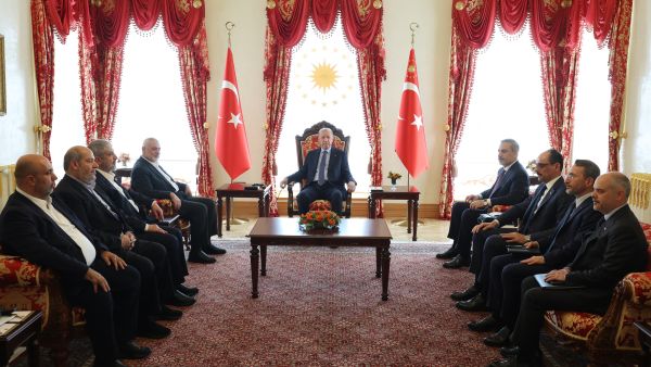 This handout photograph taken and released by Turkish Presidency Press Office on April 20, 2024, shows Turkish President Recep Tayyip Erdogan (C) meeting with Ismail Haniyeh (4thL), the political leader of the Palestinian movement Hamas, and their delegations at the Dolmabahce Presidential working office in Istanbul. Hamas political leader Ismail Haniyeh began talks with Turkey's President Recep Tayyip Erdogan in Istanbul on April 20, 2024, as Middle East tensions run high, Turkish media reported. (Photo by Handout / TURKISH PRESIDENTIAL PRESS SERVICE / AFP) Hamas Leaders in Turkey