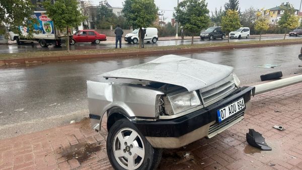Car splits in half, topples streetlight in terrifying crash