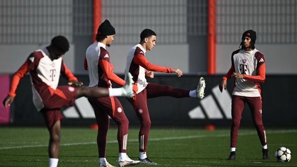 Bayern Munich's German midfielder #42 Jamal Musiala and Bayern Munich's French midfielder #17 Michael Olise (R) attend a training session on the eve of the UEFA Champions League football match FC Bayern Munich vs SL Benfica in Munich, southern Germany, on November 5, 2024. (Photo by Tobias SCHWARZ / AFP)