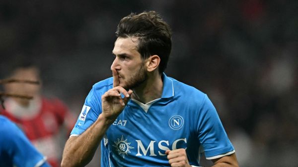 Napoli's Georgian forward #77 Khvicha Kvaratskhelia celebrates scoring his team's second goal, during the Italian Serie A football match Ac Milan vs Napoli at San Siro Meazza stadium in Milan on October 29, 2024. (Photo by Gabriel BOUYS / AFP)