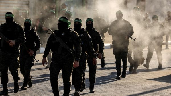 Masked members of the al-Qassam Brigades, the military wing of Hamas, march during a rally in Gaza City on July 20, 2022. (Photo by Mahmud HAMS / AFP) "Bad Faith": Hamas exposes Netanyahu’s real intentions behind Gaza ceasefire talks