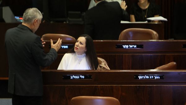 Members of the Israeli parliament Tali Gottlieb (R) for the Likud party and Meir Cohen for Yesh Atid, attend a parliament (Knesset) meeting in Jerusalem on June 28, 2023. (Photo by GIL COHEN-MAGEN / AFP Secrets and Scandal: Gottlieb's entry into Israel's most classified committee ignites political firestorm