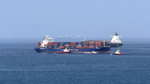 Foreign cargo ship runs aground in Strait of Hormuz as Iran defends shipping controls