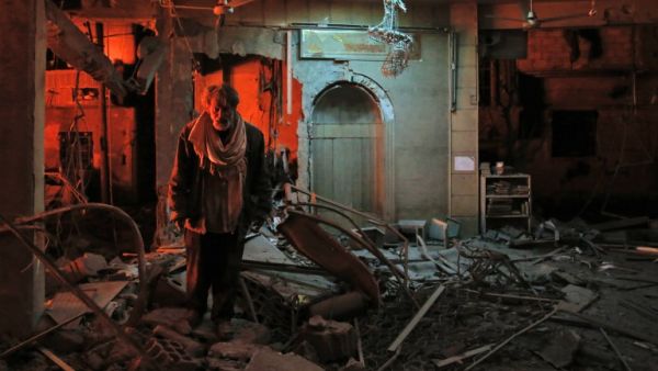 A man walks inside a mosque after an air strike in Douma, Eastern Ghouta, on Mar.19, 2018. The regime did not completely release the pressure on Douma however, the latest strikes killing at least 13 people overnight, the Syrian Observatory for Human Rights said. (HASAN MOHAMED / AFP)