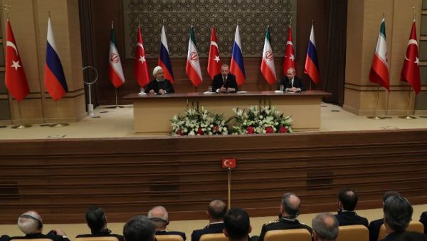 (LtoR) Iran's President Hassan Rouhani, Turkey's President Recep Tayyip Erdogan and Russia's President Vladimir Putin hold a joint press conference during a tripartite summit on Syria, in Ankara, on Apr. 4, 2018. The presidents of Iran, Turkey and Russia met on Apr. 4, 2018 for their second tripartite summit in under six months, aiming to speed the peace process for Syria and bolster their influence in the country.
(ADEM ALTAN / AFP)