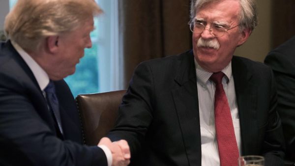 (FILES) In this file photo taken on Apr. 9, 2018 US President Donald Trump shakes hands with National Security Advisor John Bolton during a meeting with senior military leaders at the White House in Washington, DC. Trump has not decided whether or not to scrap the Iran nuclear deal, Bolton said on April 29, 2018. "He has made no decision on the nuclear deal, whether to stay in or get out," Bolton told Fox News Sunday.

(NICHOLAS KAMM / AFP)