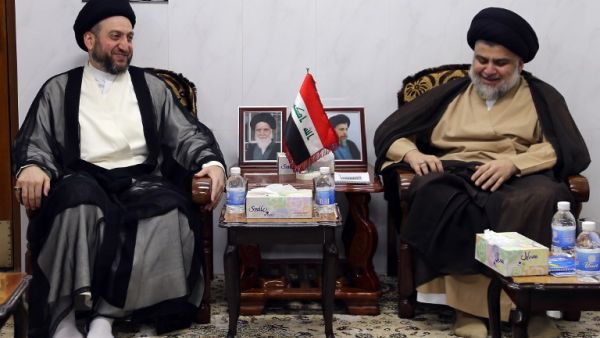 Iraqi Shiite Muslim leader and head of Hikma party Ammar al-Hakim (L) and Shiite cleric Moqtada Sadr meet in the Iraqi holy city of Najaf on May 17, 2018. Iran and its allies were mustering a bid to limit the role of fiery Shiite cleric Moqtada Sadr in Iraq's next government after his shock election win reshaped the country's political landscape. (Haidar HAMDANI / AFP) Iraqi Shiite Muslim leader and head of Hikma party Ammar al-Hakim (L) and Shiite cleric Moqtada Sadr meet in the Iraqi holy city of Najaf on May 17, 2018. Iran and its allies were mustering a bid to limit the role of fiery Shiite cleric Moqtada Sadr in Iraq's next government after his shock election win reshaped the country's political landscape. (Haidar HAMDANI / AFP)