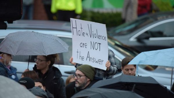 People gather for a vigil in Squirrel Hill, Pennsylvania on October 27, 2018, to remember those that died in the Tree of Life Synagogue shooting earlier in the day (AFP)