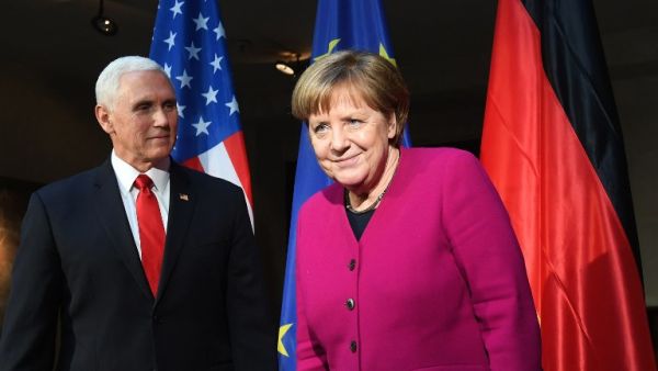 German Chancellor Angela Merkel (R) and US Vice President Mike Pence pose during a photo call at the 55th Munich Security Conference in Munich, southern Germany, on February 16, 2019. The 2019 edition of the Munich Security Conference (MSC) takes place from February 15 to 17, 2019. 
Christof STACHE / AFP