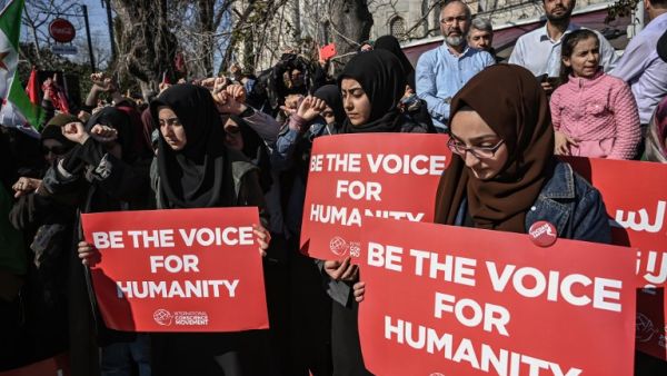 Women hold placards during a rally against the imprisonment of women and children in Syria, near Hagia Sophia in the Turkish city of Istanbul, on March 8, 2019, as International Women's Day is being celebrated around the world. 
Ozan KOSE / AFP 