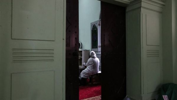 A Muslim woman attends a special prayer for the victims of the Christchurch mass shooting in New Zealand (AFP)