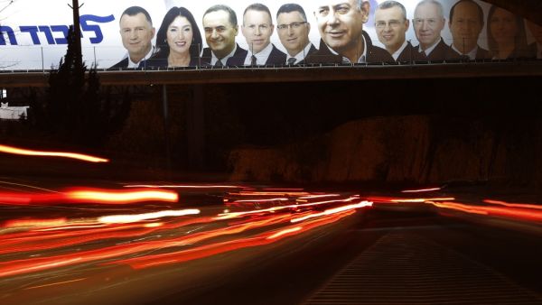 A picture taken on April 7, 2019 shows a Likud party electoral billboard for Israel's upcoming general elections bearing the portrait of Prime Minister Benjamin Netanyahu (C) and his party candidates in Jerusalem. 
Ahmad GHARABLI / AFP