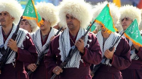 Turkmen Basij militiamen take part in an annual military parade marking the Iran-Iraq war, in the Iranian capital Tehran. (AFP/File Photo)
