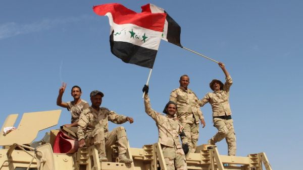 Iraqi government forces wave their national flags on March 10, 2016 after retaking the town of Zankura, northwest of Ramadi, from Daesh in Anbar province. (AFP/Moadh al-Dulami) Iraqi government forces wave their national flags on March 10, 2016 after retaking the town of Zankura, northwest of Ramadi, from Daesh in Anbar province. (AFP/Moadh al-Dulami)