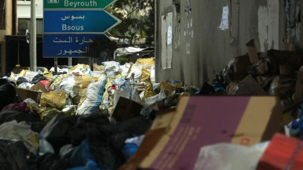 Road signs stand in the middle of a temporary garbage dump in the area of Jamhour, east of the Lebanese capital Beirut, on March 15, 2016. (AFP/Patrick Baz)