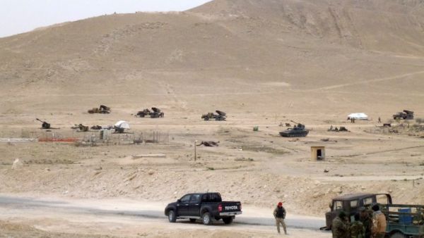 Syrian pro-government forces hold a position on the outskirts of Palmyra on March 26, 2016, during a military operation to retake the ancient city from Daesh. (AFP/Maher Al Mounes)