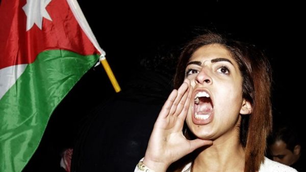 A Jordanian woman chanting during a protest (AFP/File Photo)	