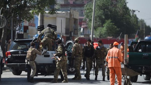 Security forces in Kabul leave the site of Monday's bombing. (WAKIL KOHSAR / AFP)