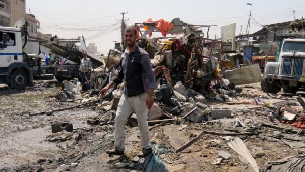 A man stands at the site of the deadly bomb blast which killed 11. (AFP)