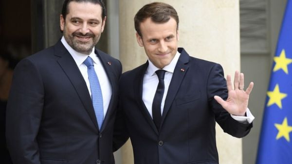French President Emmanuel Macron welcomes Lebanese Prime Minister Saad Hariri at the Elysee Presidential Palace. (AFP/ File)