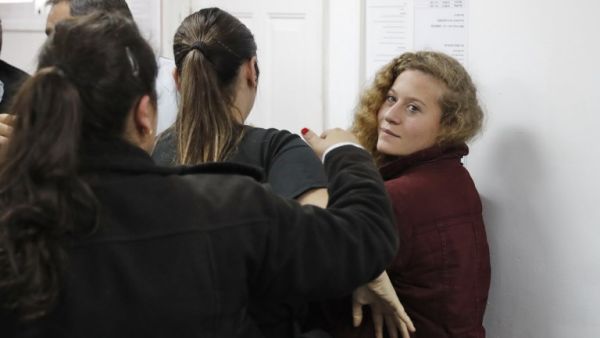 Palestinian Ahed Tamimi (R), 17, a well-known campaigner against Israel's occupation, appears at a military court at the Israeli-run Ofer prison in the West Bank village of Betunia on Dec. 20, 2017 (Ahmad GHARABLI/AFP)