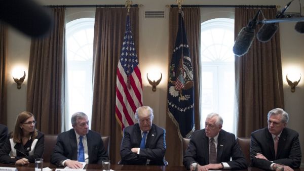 US President Donald Trump (C) listens during a meeting with bipartisan members of the Senate on immigration at the White House in Washington, DC, on Jan. 9, 2018 (JIM WATSON / AFP) US President Donald Trump (C) listens during a meeting with bipartisan members of the Senate on immigration at the White House in Washington, DC, on Jan. 9, 2018 (JIM WATSON / AFP)