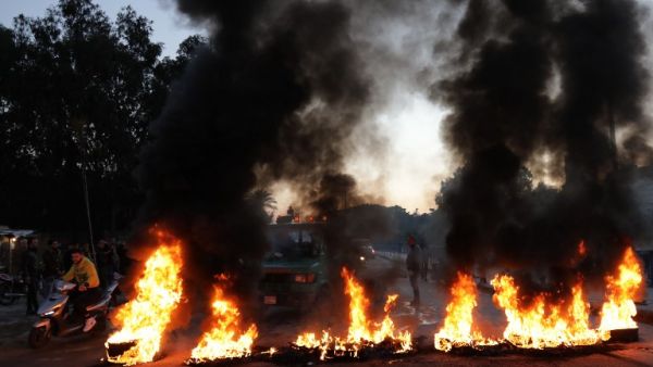 Supporters of Lebanon's Shiite Muslim parliament speaker burn tires to block a main road in Beirut on Jan. 29, 2018, following a row over a leaked video in which the foreign minister, a Maronite, called him a "thug" (ANWAR AMRO / AFP)