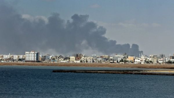 Smoke billows in the government's de facto capital Aden, as fighters from the separatist Southern Transitional Council move closer to taking full control of the southern city, on Jan. 30 (SALEH AL-OBEIDI / AFP)