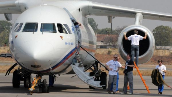  This file photo taken on March 5, 2010 in Hyderabad shows technicians and officials standing beside an Antonov An-148 aircraft on display during The India Aviation 2010 show at Begumpet Airport (Noah SEELAM / AFP)
