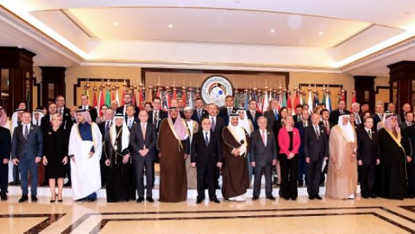 Kuwaiti Foreign Minister Sheikh Sabah al-Khaled al-Sabah (C) stands next to Iraq Prime Minister Haider al-Abadi, EU Foreign Policy Chief Frederica Mogherini, U.N. Secretary-General Antonio Guterres as they pose with other officials for a group photo on the second day of an international conference for reconstruction of Iraq , in Kuwait City, on Feb. 14, 2018 (YASSER AL-ZAYYAT / AFP)