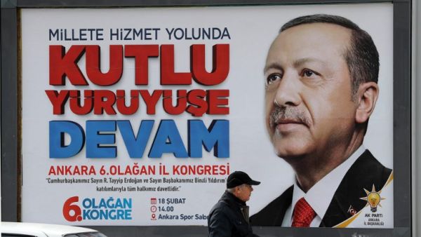 A billboard displays an image of President of Turkey and Leader of the Justice and Development Party (AK Party) Recep Tayyip Erdogan reading "continue the blessed march " in Ankara, on Feb. 14, 2018, four days ahead of the party's 6th ordinary congress in the Turkish capital. 
(ADEM ALTAN / AFP)