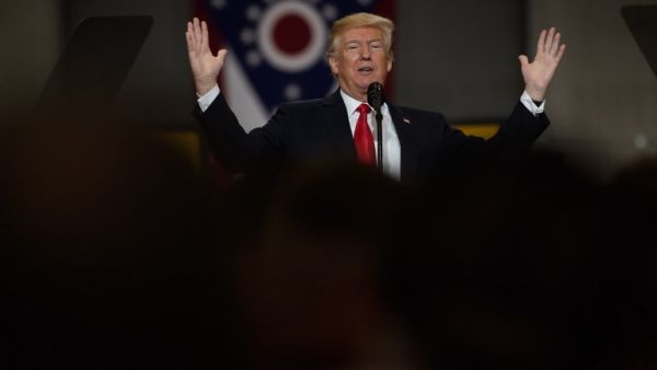 U.S. President Donald Trump speaks to a crowd gathered at the Local 18 Richfield Facility of the Operating Engineers Apprentice and Training, a union and apprentice training center specializing in the repair and operation of heavy equipment on Mar. 29, 2018 in Richfield, Ohio. President Trump's remarks centered upon infrastructure investment in the economy and labor statistics. 
(JEFF SWENSEN / GETTY IMAGES NORTH AMERICA / AFP)