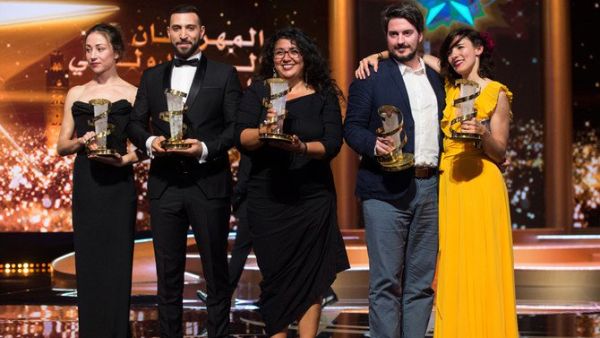 Sudabeh Mortezai (center) poses with her trophy. (Source: AFP)