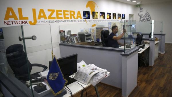 NewsGuard has urged readers to “proceed with extreme caution” when disseminating any output of the channel Al-Jazeera English. (AFP)