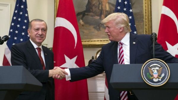  US President Donald Trump shakes hands with Turkish President Recep Tayyip Erdogan (AFP/File Photo)	