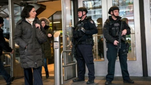 Police stand guard at an entrance to the  bus terminal in New York (AFP/File Photo)