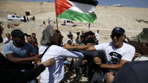 A French-American citizen and two other activists were arrested in the Bedouin village of Khan al-Ahmar. (AFP/File)
