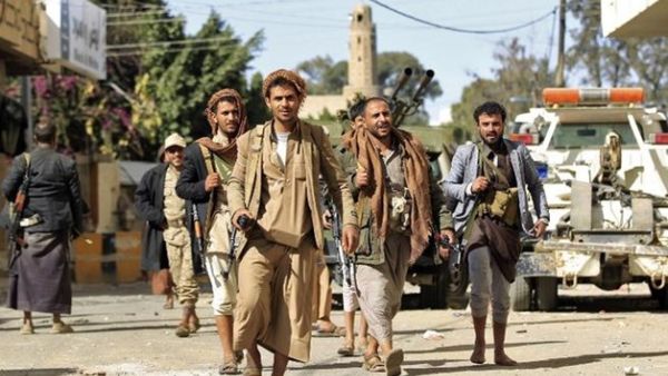 Houthi rebel fighters are seen outside of the residence of Yemen's former President Ali Abdullah Saleh in Sanaa. AFP/Mohammed Huwais