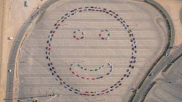 143 cars were used to form the smiley face (Twitter/Dubai Police) 143 cars were used to form the smiley face (Twitter/Dubai Police)