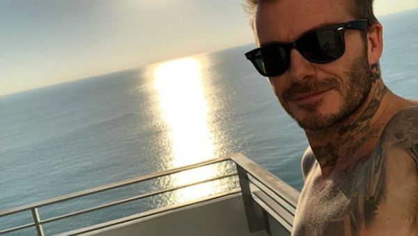 'Look stressed there Becks!' Cocky David shared a sun-soaked snap from aboard a boat in Miami... prompting fellow-footballer Steven Gerrard to tease him for fleeing London's snow (Source: David Beckham -
 Instagram)