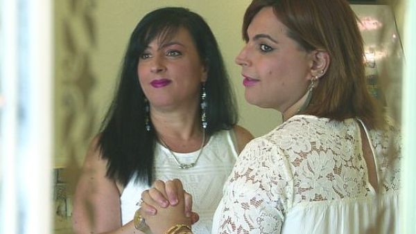 Twenty years after their first wedding Galit, left, and Amit remarried as wife and wife. Footage shows the couple beaming from ear to ear, wearing matching white dresses and dancing a song that translates to 'Blessed be he who made me a woman' (dailymail)