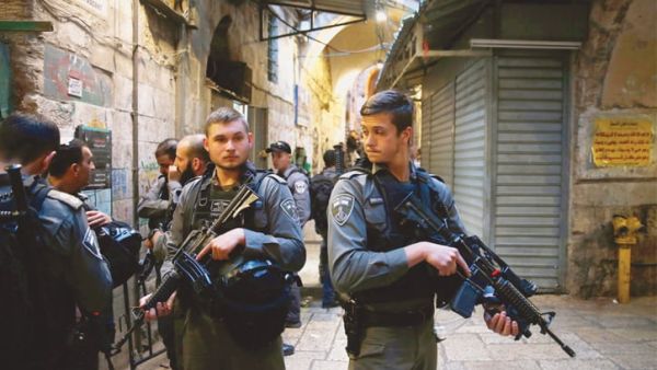  Israeli soldiers stand in readiness for further raids. AFP/File Photo)