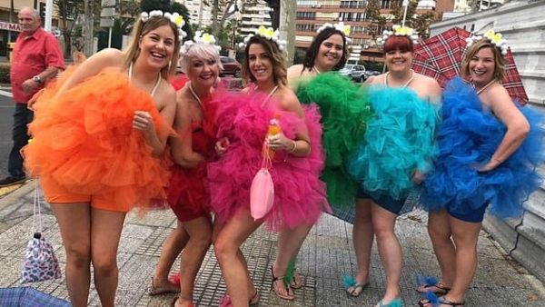 Six friends show off their colourful outfits. The event takes place annually, a day after the official Benidorm fiesta ends (dailymail)