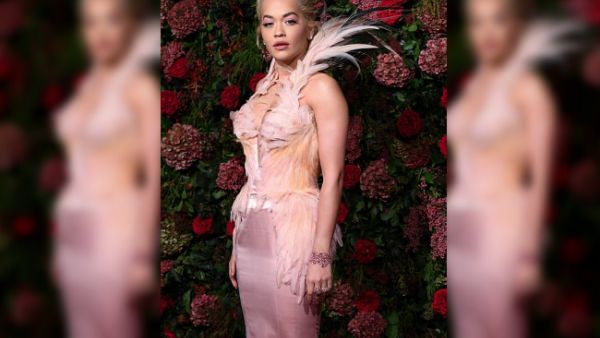 Ruffling feathers: Rita ensured she took centre stage in her bodycon dress, featuring a dramatic feathered collar, with matching detailing running down the bodice and her hips (Source: David Fisher - REX - Shutterstock) Ruffling feathers: Rita ensured she took centre stage in her bodycon dress, featuring a dramatic feathered collar, with matching detailing running down the bodice and her hips (Source: David Fisher - REX - Shutterstock)